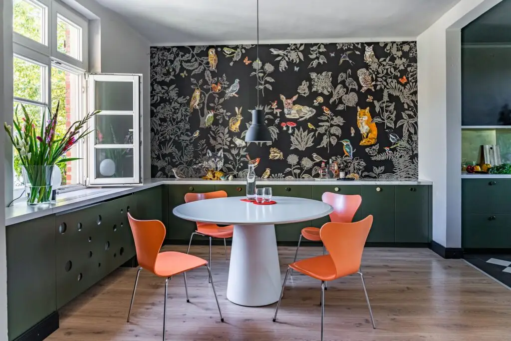 Maximalist wallpaper in modern dining room